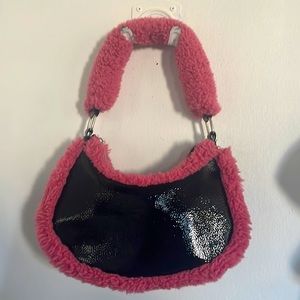 Black pho leather with a pink fur trim. SK NNY DIP from Macys